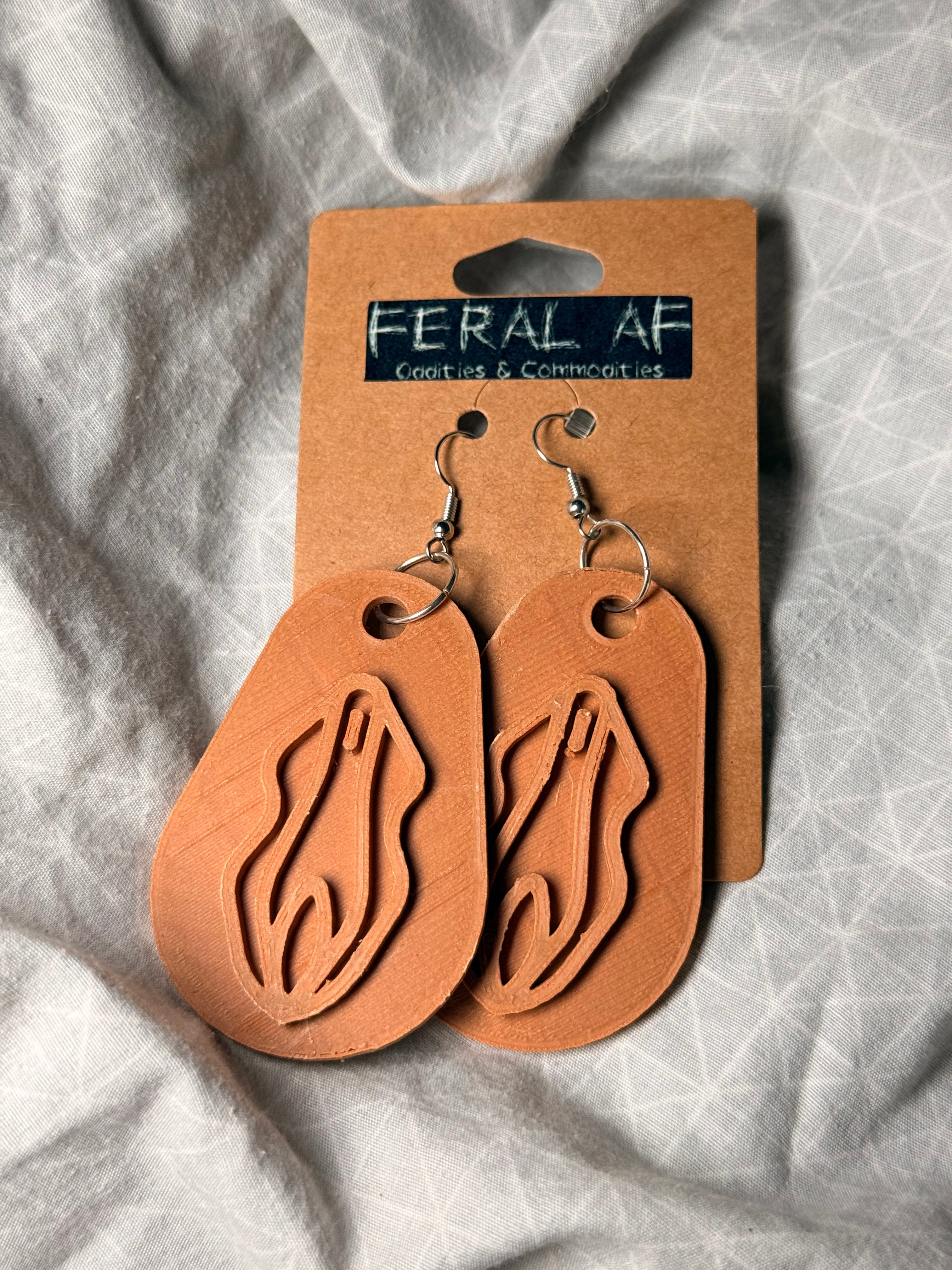 Lt brown vagina 3D earrings